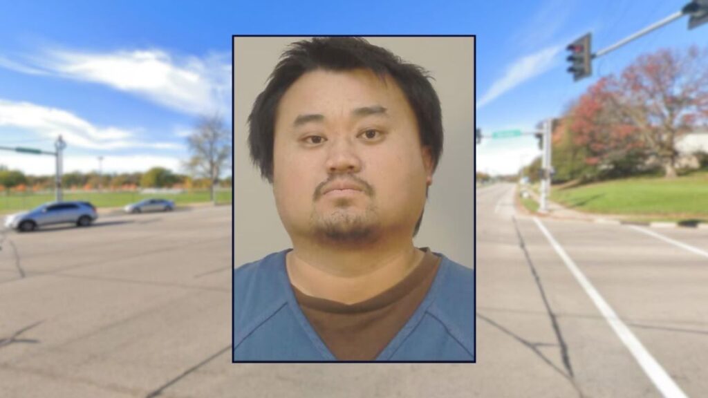 Man pinned a 63-year-old woman's arm in her car door after she honked at him, police say